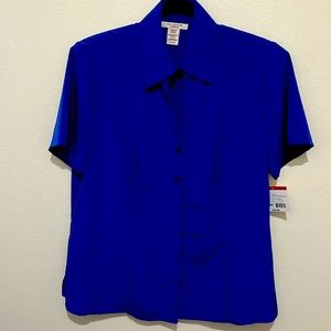 Beautiful Royal blue blouse. Never worn, tag still on. Silky feel polyester.